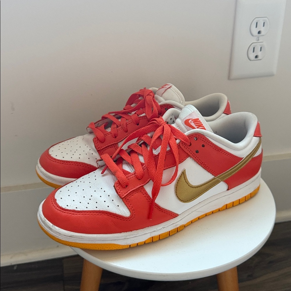 Nike White and Gold Sneakers with Red Accents